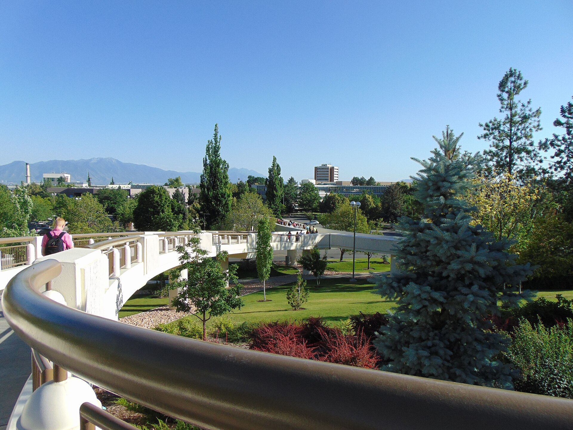 An outdoor walkway on the BYU campus in Provo with the Kimball Tower in the distance